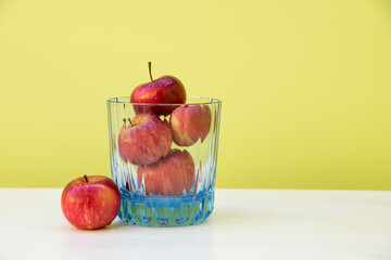Apples in a glass. Concept of apple as a sip of health