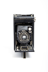 1910 vintage single-lens camera on white background
