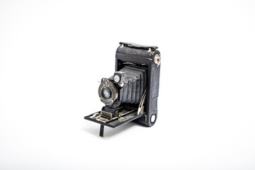 1910 vintage single-lens camera on white background