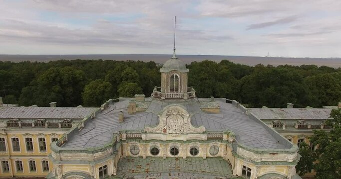4K cloudy day aerial drone video of beautiful vintage architecture of Znamenka Estate, green park and palace near Peterhof center, in the suburbs of Saint Petersburg, the Russia's northern capital