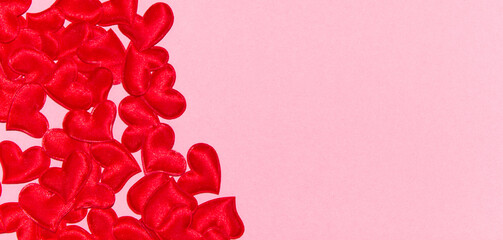 Red hearts on pink background. Valentine's day composition. Top View, flatly, copy space.
