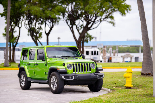 MIAMI BEACH, FL, USA - NOVEMBER 25, 2020: Photo of a 2020 2021 Jeep Wrangler green front quarter view