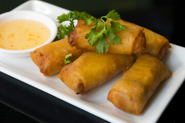 Vegetable spring rolls with plum sauce