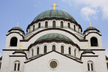 Fototapeta na wymiar Close-up of the upper part of the facade of the Serbian Orthodox Church of Saint Sava in Belgrade, Serbia