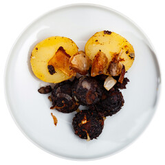 Blood sausage black pudding served with boiled potato and fried onion. Isolated over white...
