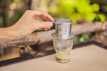 coffee dripping in vietnamese style on wooden table