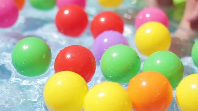 Balls Floating in Kiddie Pool