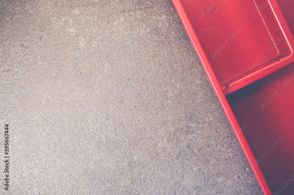 Poster Top view of red Japanese lunch box on a rough-textured surface with copy space