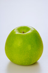 Organic whole green apple and isolated on white background.