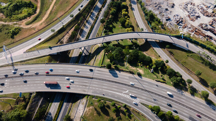 Aerial view of elevated higway with multiple exit and junctions on an urban city area