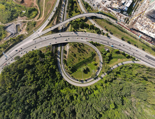 Aerial view of elevated higway with multiple exit and junctions on an urban city area