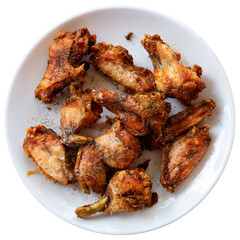 Plate with hot spicy homemade baked chicken wings. Isolated over white background