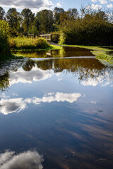 Flooded trail after the storm, gravel path around Larson Lake covered in water
