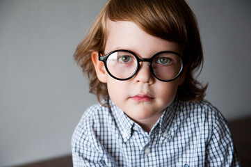 Portrait of a cute child in vision-correcting glasses.
