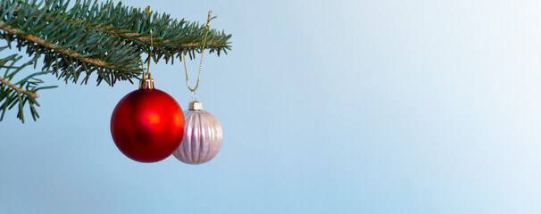 Christmas balls hung on a Christmas tree. ...