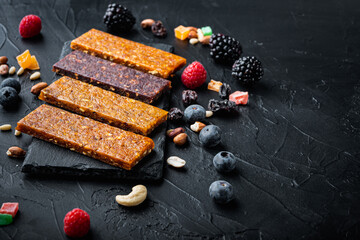 Dried fruits bars with copy space,on black background