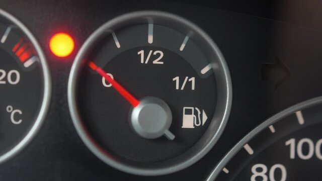Fuel Gauge and Indicator Lights of Starting and Stopping Car Close Up