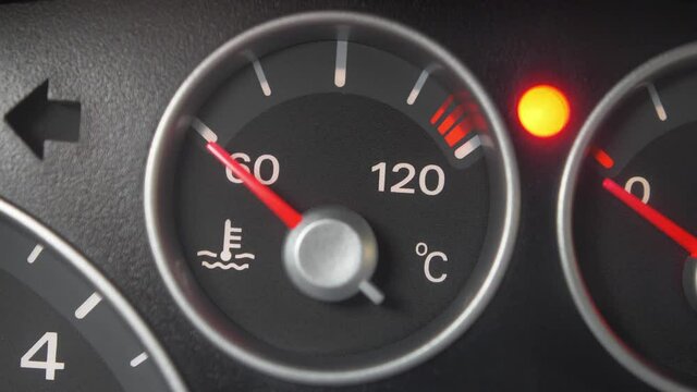 Oil Temperature Gauge and Indicator Lights of Starting and Stopping Car Close Up