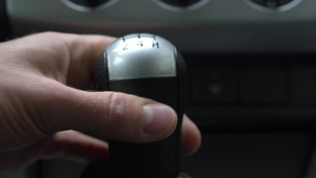 Angry Driver Changing Gears Fiercely with Manual Transmission Gear Stick