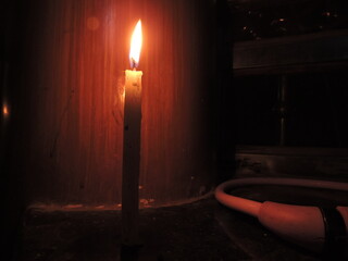 burning candle in the dark
