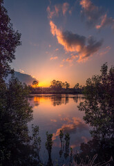 Beautiful Riverside Sunset with Reflections in Portrait Mode