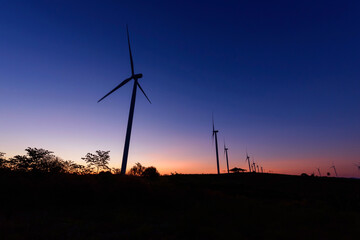 wind turbines park for make the electric power from wind in sunrise time