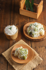 Sentiling is Indonesian traditional snack made from steamed grated cassava with food grade colorants and served with steamed fresh grated coconut.