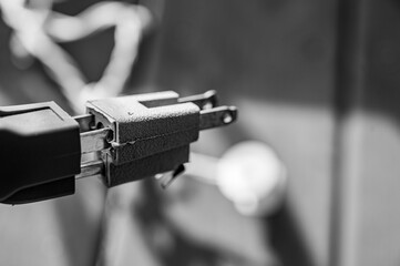 Demonstrating using a 3-prong adapter to connect two power cords