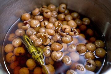 Longan date soup in a cooking pot, traditional Chinese food.