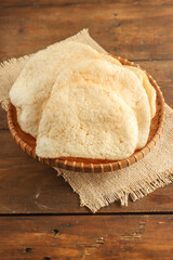 Kerupuk Udang or Prawn crackers are made from tapioca flour and finely ground shrimp mixed with herbs and flavor enhancers.