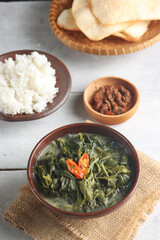 Sayur Bobor daun lembayung or long bean leaves coconut milk soup is made from long bean leafs cooked in coconut milk and spices one of the traditional dishes from Indonesia.
