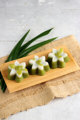 Talam Pandan or Steamed Pandan Rice Flour Pudding is one of Indonesian traditional dessert, part of Jajan Pasar series, meaning Market Street Food. It is made of coconut milk, rice flour and pandan.