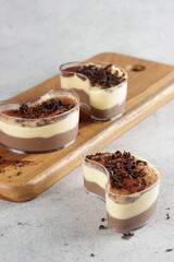 Tiramisu dan kopi mouse, Tiramisu and coffee mousse in glass, topping with chocolate, traditional Italian dessert made of mascarpone.