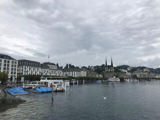 Fototapeta na wymiar lake view with Church of St. Leodegar or Hofkirche St. Leodegar in Lucerne city, Switzerland