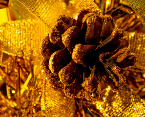  Christmas tree decorations with Pine Cone fortuna gold color on a shining background.