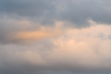 Naklejka na ściany i meble Stormy cloudy sky in shades of gray as a nature background 