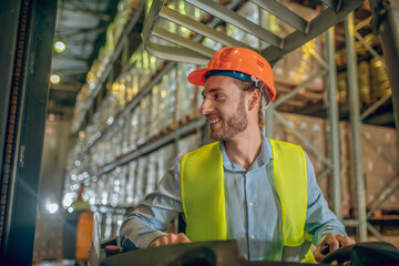Young bearded worker smiling and looking aside