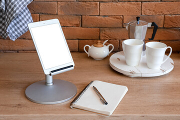 Modern tablet computer in kitchen