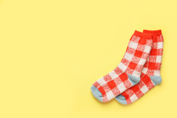 Warm socks on color background