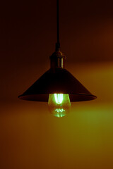 Three lamps with vintage incandescent bulbs. Red light.