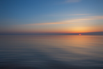 Fototapeta na wymiar Baltic Sea, with calm waves, and a beautiful sunset