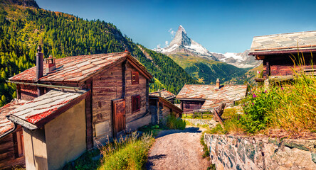 Adorable summer morning in Zermatt village with Matterhorn (Monte Cervino, Mont Cervin) peak on...