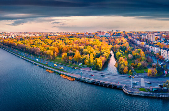 Colorful autumn cityscape of Ternopil town, Ukraine, Europe. Splendid morning view from flying drone of Ternopil lake. Traveling concept background.