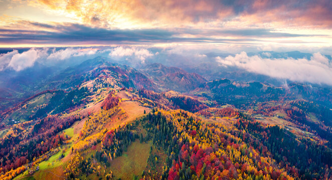 Unbelievable autumn view from flying drone of mountain ridge. Great sunrise inCarpathian mountains, Ukraine, Europe. Beauty of nature concept background. Aerial landscape photography..