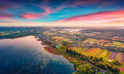 Aerial landscape photography. Stunning view from flying drone of Ostrivianske Lake. Beautiful sunrise on Ostriv'ya village, Shatsky National Park, Volyn region, Ukraine, Europe.