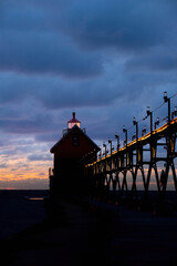 Fototapeta na wymiar lighthouse at sunset, on Lake Michigan