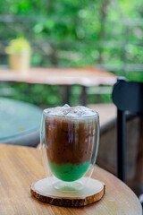 cocoa mixed with mint ice beverage on cafe background
