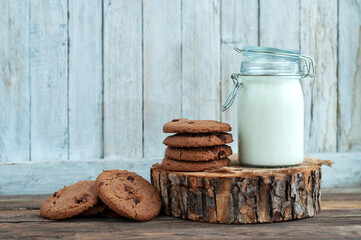milk and cookies on a wooden table