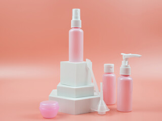 Pink cosmetic bottles for cream, gel, lotion. Skincare cosmetic concept.