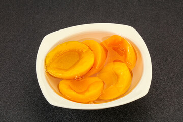 Marinated peaches fruit in the bowl
